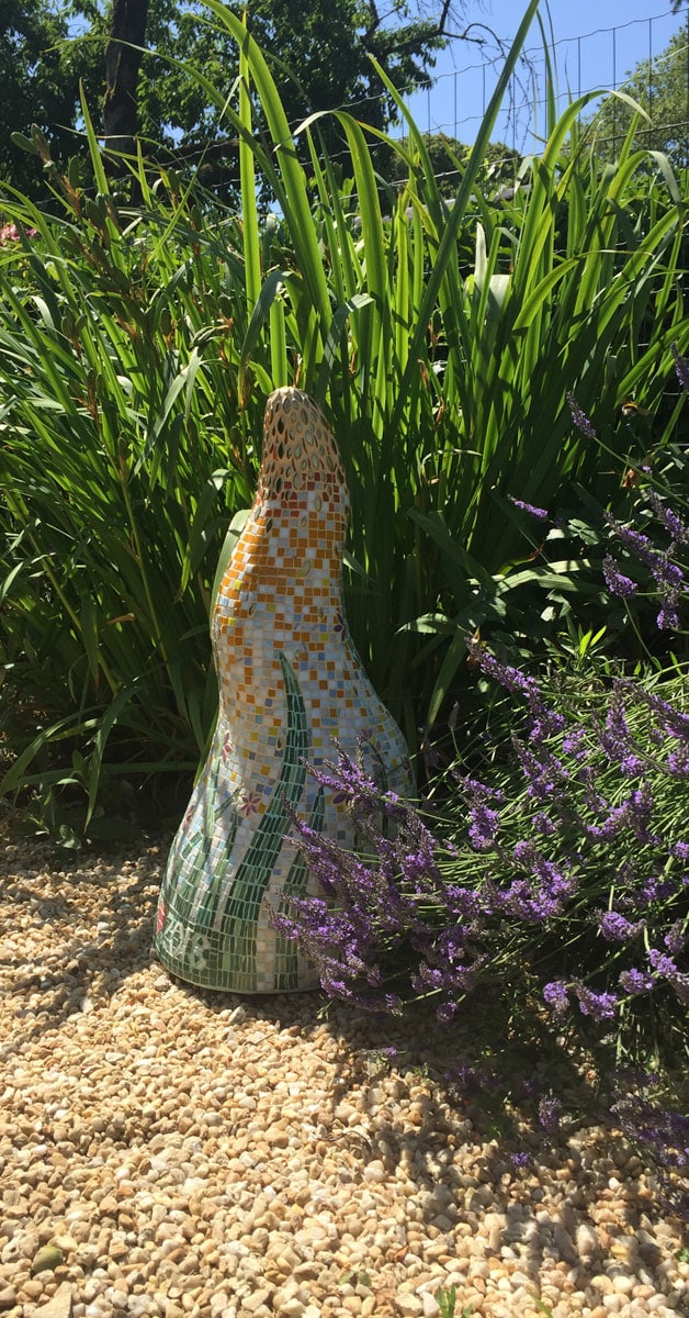 finished mosaic sculpture in its garden home