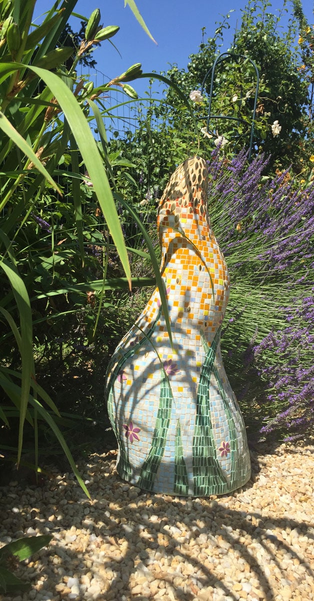 finished mosaic sculpture in its garden home
