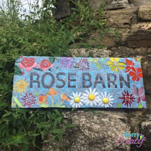 mosaic sign with flower design