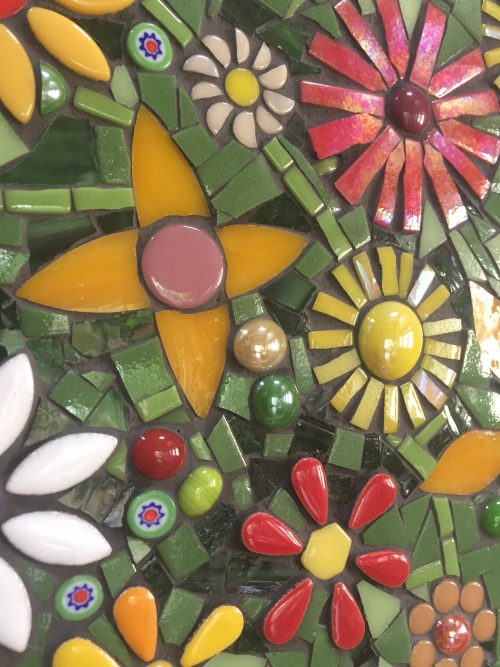 orange, yellow and red flowers in a mosaic artwork