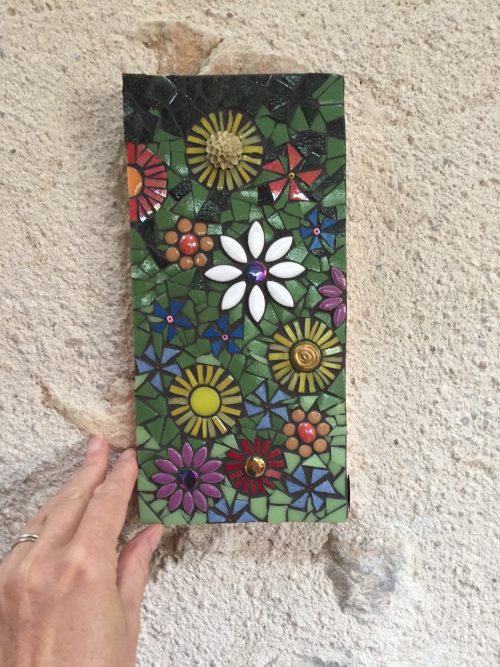 floral mosaic hanging on a wall