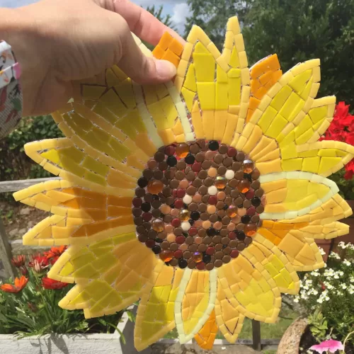 mosaic finished and held up to camera in outdoor sunshine