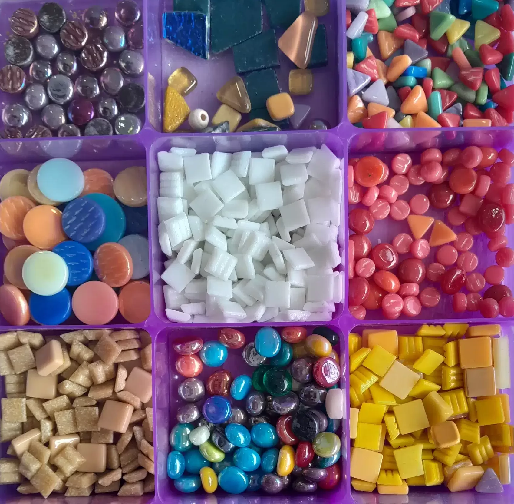 glass and ceramic mosaic tiles in a colourful tray
