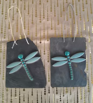 dragonfly made using glass gems and mosaic tiles, glued to slate