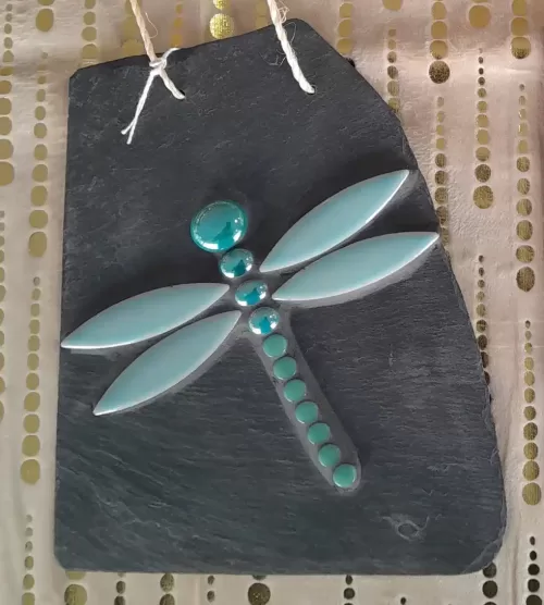 dragonfly made using glass gems and mosaic tiles, glued to slate