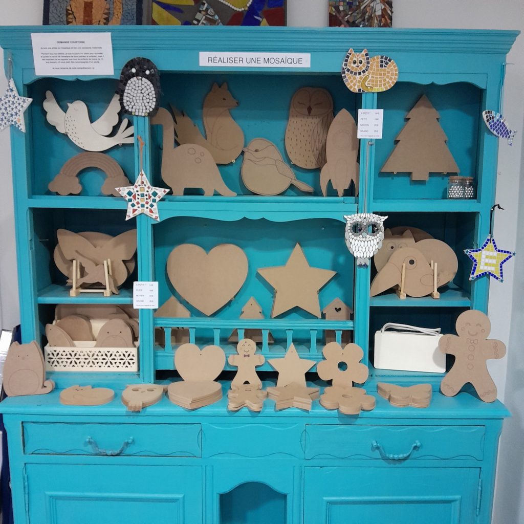 20241121_181649 large selection of wooden MDF shapes for mosaic-making organised on a turquoise dresser